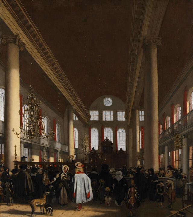 A painting of the Portuguese Synagogue, a large, open building with interior columns, chandeliers, and many windows. There is a large group of men, women and children inside, facing the ark, and a couple of dogs near the entrance.