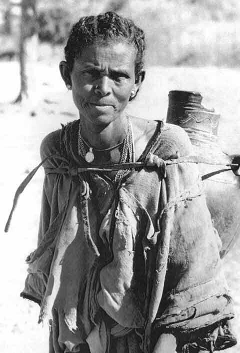 A Woman Hauls Water From a Well in Ambover, Ethiopia