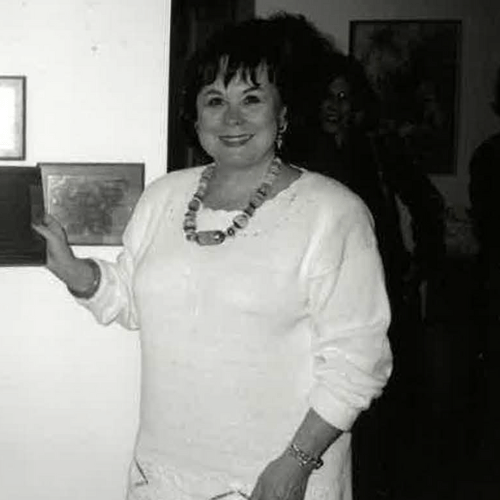 black and white photograph of a woman in a white dress