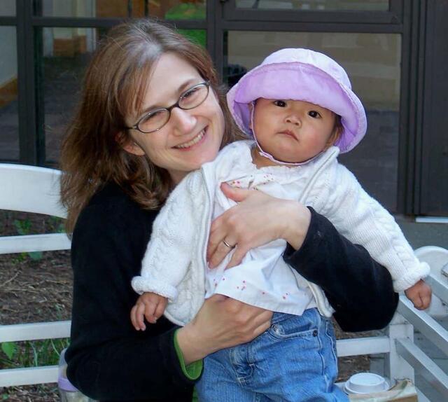 Jennifer Sartori holding her baby baby daughter