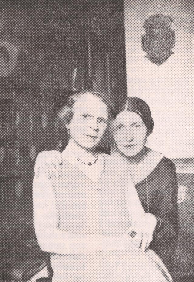 Black and white historical photograph of two women seated