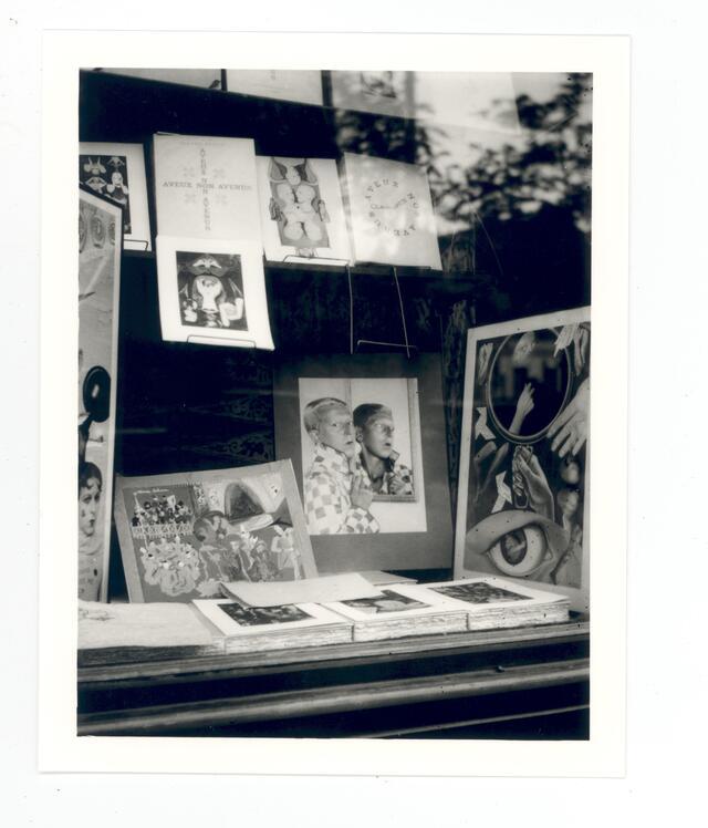 black and white photograph of the window display of a bookstore
