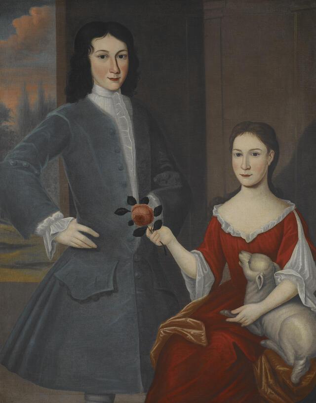 potrait of a young man in a gray jacket and a young woman in a red gown with a lamb on her lap
