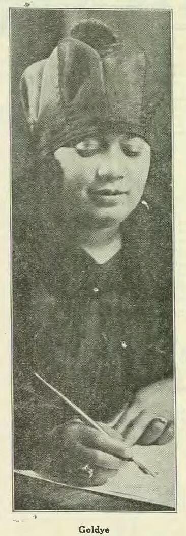black and white newspaper photograph of a Black woman wearing a hat holding a fountain pen