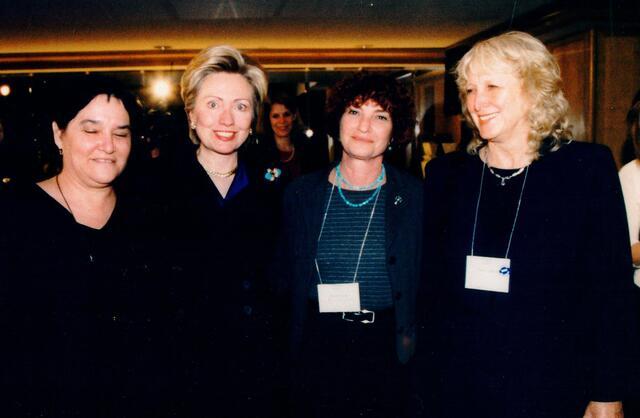 photograph of four women at a meeting