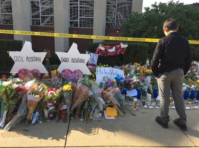 A boy mourns outside Tree of Life Synagogue