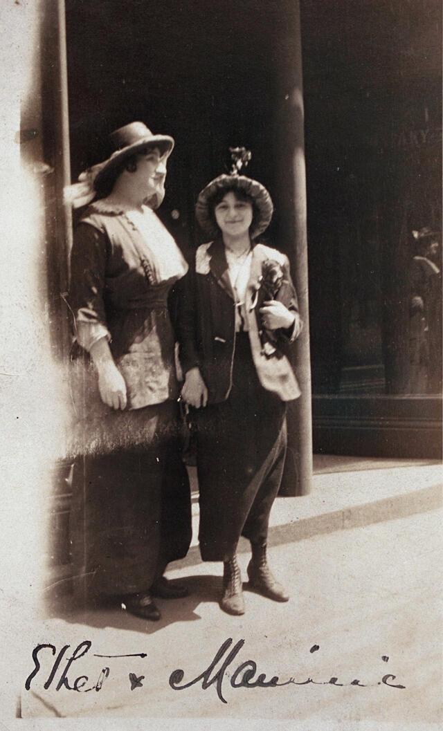 black and white photograph of two women in dresses