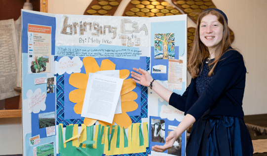 2016-2017 Rising Voices Fellow Molly Pifko with her Bat Mitzvah Project Display