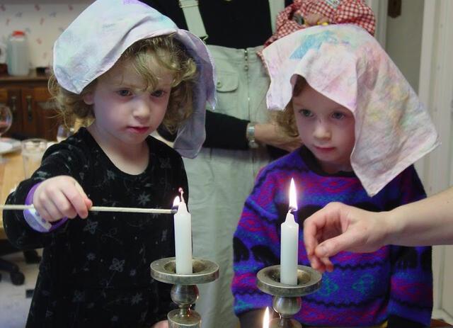 2016-2017 Rising Voices Fellow Sarah Biskowitz and her Sister Lighting Shabbat Candles